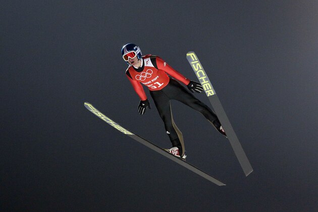Germany's Richard Freitag soars through the air during men's ski jumping training at the 2014 Winter Olympics, Sunday, Feb. 16, 2014, in Krasnaya Polyana, Russia. (AP Photo/Matthias Schrader)