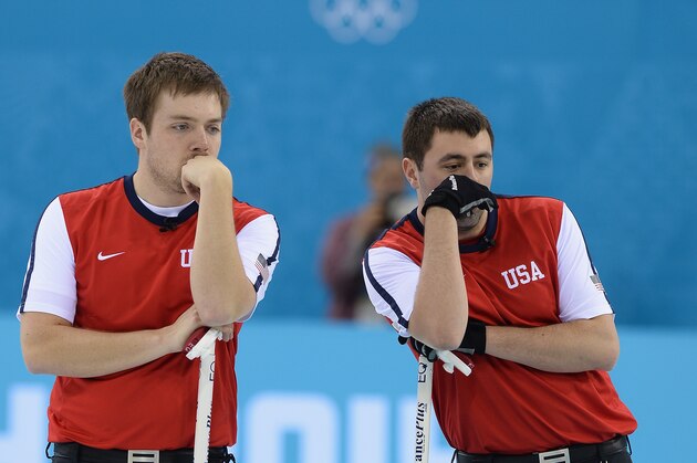 SOCHI, RUSSIA - FEBRUARY 14:  Teammates John Landsteiner (L) and Jared Zezel of the U.S.A compete in the men's round robin session against Germany during day seven of the Sochi 2014 Winter Olympics at Ice Cube Curling Center on February 14, 2014 in Sochi, Russia.  (Photo by Pascal Le Segretain/Getty Images)