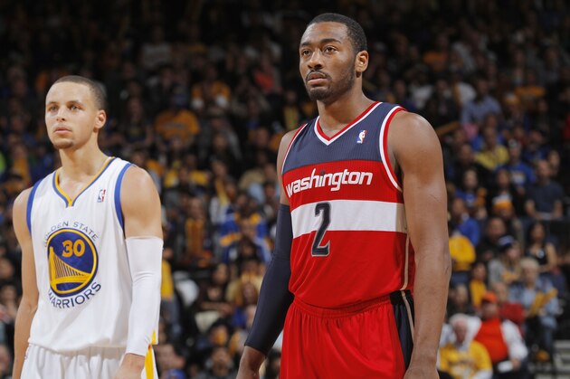 OAKLAND, CA - JANUARY 28: John Wall #2 of the Washington Wizards and Stephen Curry #30 of the Golden State Warriors on January 28, 2014 at Oracle Arena in Oakland, California. NOTE TO USER: User expressly acknowledges and agrees that, by downloading and or using this photograph, user is consenting to the terms and conditions of Getty Images License Agreement. Mandatory Copyright Notice: Copyright 2014 NBAE (Photo by Rocky Widner/NBAE via Getty Images)