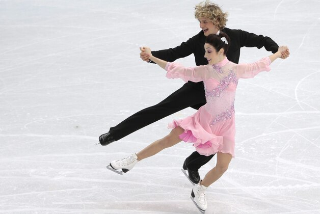 Meryl Davis and Charlie White of the United States compete in the ice dance short dance figure skating competition at the Iceberg Skating Palace during the 2014 Winter Olympics, Sunday, Feb. 16, 2014, in Sochi, Russia. (AP Photo/Ivan Sekretarev)