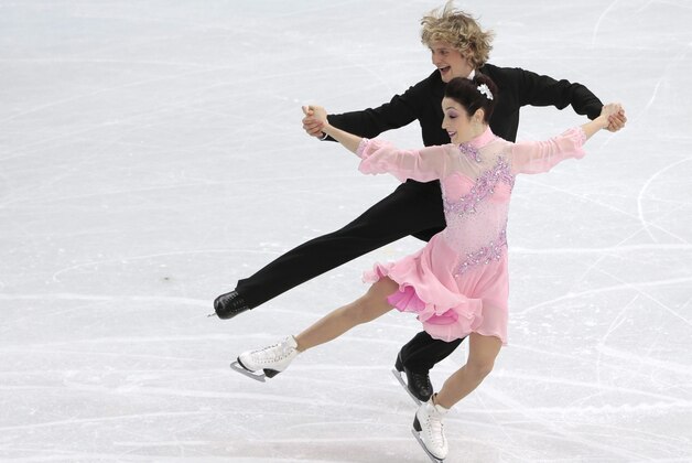 Meryl Davis and Charlie White of the United States compete in the ice dance short dance figure skating competition at the Iceberg Skating Palace during the 2014 Winter Olympics, Sunday, Feb. 16, 2014, in Sochi, Russia. (AP Photo/Ivan Sekretarev)