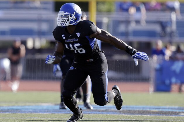 Buffalo linebacker Khalil Mack (46) runs on the field during the first half of an NCAA football game against the Connecticut on Saturday, Sept. 28, 2013, in Buffalo, N.Y. (AP Photo/Mike Groll)