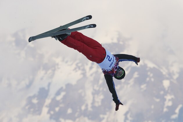 China's Qi Guangpu jumps during men's freestyle skiing aerials training at the Rosa Khutor Extreme Park, at the 2014 Winter Olympics, Sunday, Feb. 16, 2014, in Krasnaya Polyana, Russia. (AP Photo/Sergei Grits)