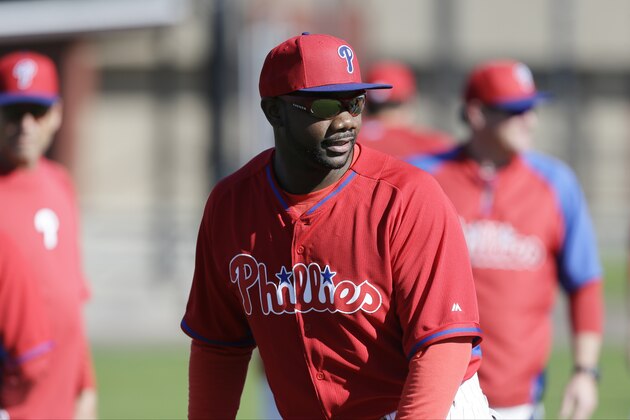 Philadelphia Phillies first baseman Ryan Howard looks on during spring training baseball practice Sunday, Feb. 16, 2014, in Clearwater, Fla. (AP Photo/Charlie Neibergall)