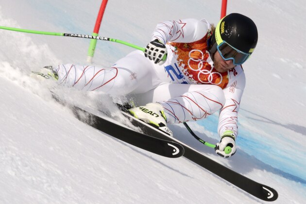 United States' Andrew Weibrecht passes a gate to win the silver medal in the men's super-G at the Sochi 2014 Winter Olympics, Sunday, Feb. 16, 2014, in Krasnaya Polyana, Russia. (AP Photo/Charles Krupa)