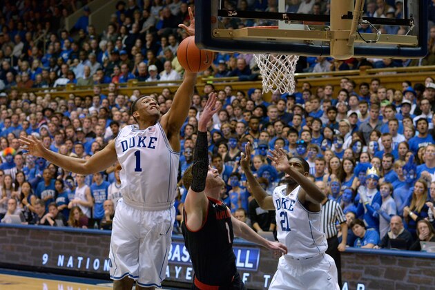 DURHAM, NC - FEBRUARY 15: Jabari Parker #1 of the Duke Blue Devils blocks a shot by Evan Smotrycz #1 of the Maryland Terrapins during their game at Cameron Indoor Stadium on February 15, 2014 in Durham, North Carolina. Duke won 69-67. (Photo by Grant Halverson/Getty Images) DURHAM, NC - FEBRUARY 15: Jabari Parker #1 of the Duke Blue Devils blocks a shot by Evan Smotrycz #1 of the Maryland Terrapins during their game at Cameron Indoor Stadium on February 15, 2014 in Durham, North Carolina. Duke won 69-67. (Photo by Grant Halverson/Getty Images)