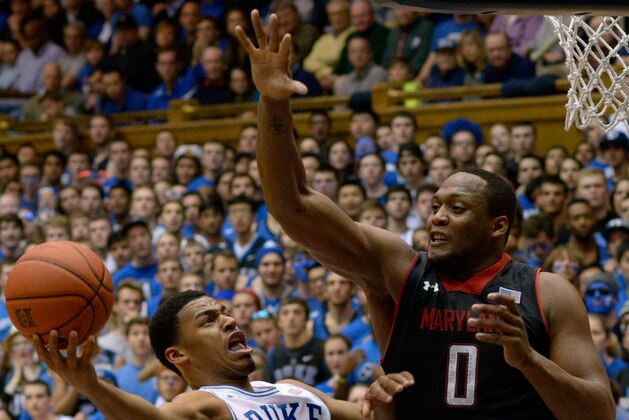 DURHAM, NC - FEBRUARY 15:  Charles Mitchell #0 of the Maryland Terrapins defends a shot by Quinn Cook #2 of the Duke Blue Devils during their game at Cameron Indoor Stadium on February 15, 2014 in Durham, North Carolina. Duke won 69-67.  (Photo by Grant Halverson/Getty Images)