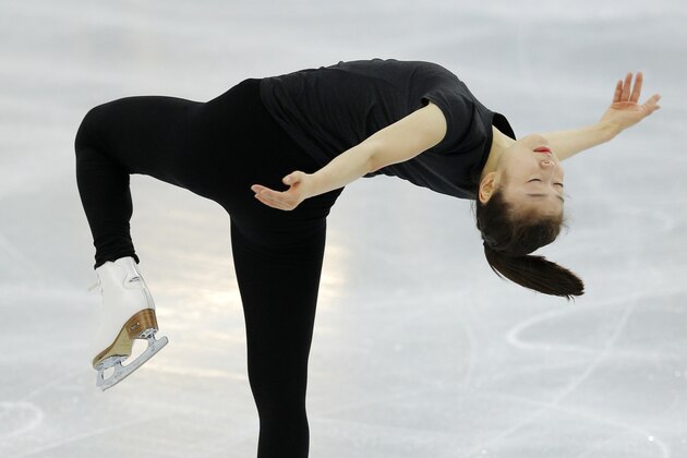 Figure skater Yuna Kim of South Korea skates in the practice rink at the 2014 Winter Olympics, Thursday, Feb. 13, 2014, in Sochi, Russia. (AP Photo/Vadim Ghirda)