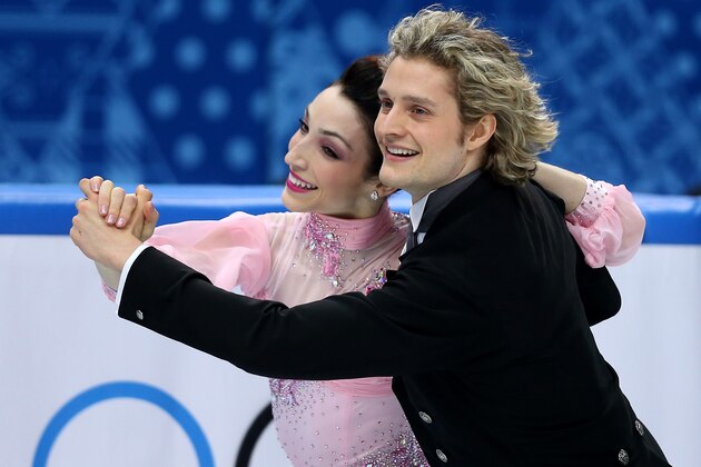 SOCHI, RUSSIA - FEBRUARY 16:  Meryl Davis and Charlie White of the United States compete during the Figure Skating Ice Dance Short Dance on day 9 of the Sochi 2014 Winter Olympics at Iceberg Skating Palace on February 16, 2014 in Sochi, Russia.  (Photo by Matthew Stockman/Getty Images)