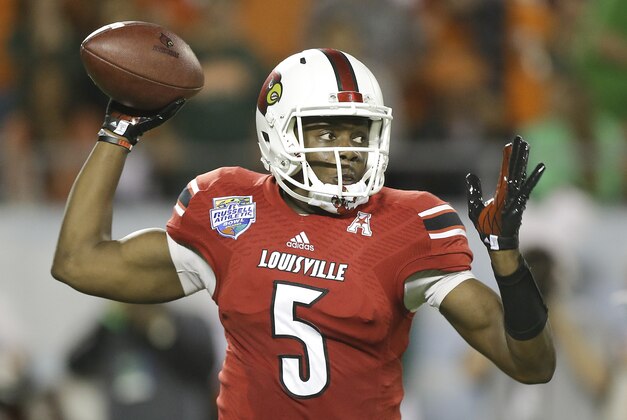 Louisville quarterback Teddy Bridgewater throws a pass during the first half of the Russell Athletic Bowl NCAA college football game against Miami in Orlando, Fla., Saturday, Dec. 28, 2013.(AP Photo/John Raoux)