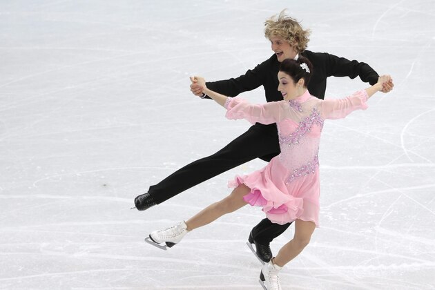 Meryl Davis and Charlie White of the United States compete in the ice dance short dance figure skating competition at the Iceberg Skating Palace during the 2014 Winter Olympics, Sunday, Feb. 16, 2014, in Sochi, Russia. (AP Photo/Ivan Sekretarev)