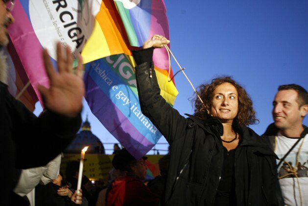 Italian transgender and former communist lawmaker Vladimir Luxuria mimics a hanging, outside St. Peter's Square at the Vatican during a candle-lit demonstration for gay rights, in Rome, Saturday Dec. 6, 2008. (AP Photo/Alessandra Tarantino)