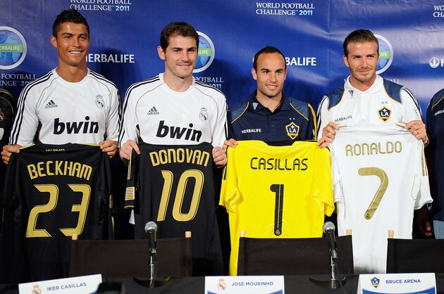 LOS ANGELES, CA - JULY 12:  Real Madrid players  Cristiano Ronaldo, (2L) goalkeeper Iker Casillas and coach Jose Mourinho (L) pose with Los Angeles Galaxy players Landon Donovan, David Beckham (2R) and coach Bruce Arena after a news conference to announce the Herbalife World Football Challange 2011 friendly soccer torunament between 13 european and US soccer clubs on July 12, 2011 in Los Angeles, California. The Los Angeles Galaxy will play Real Madrid in a friendly soccer match on Saturday.  (Photo by Kevork Djansezian/Getty Images)