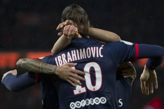 Paris Saint Germain's Zlatan Ibrahimovic, right, of Sweden celebrates with teammates after scoring against Bordeaux during their French League One soccer match, Friday Jan. 31, 2014, at Parc des Princes stadium, in Paris, France. (AP Photo/Jacques Brinon)