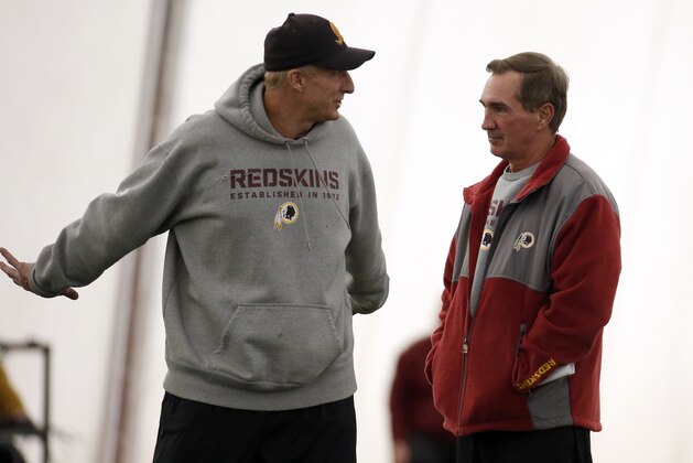 Washington Redskins defensive coordinator Jim Haslett talks with head coach Mike Shanahan during their NFL football practice Wednesday, Dec. 11, 2013, in Ashburn, Va. Kirk Cousins will start for the Washington Redskins on Sunday, and Robert Griffin III will be the No. 3 quarterback behind Rex Grossman. (AP Photo/Alex Brandon)