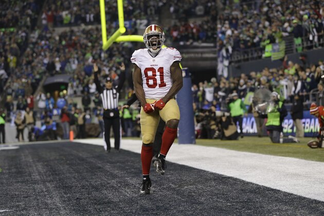 San Francisco 49ers' Anquan Boldin celebrates his touch-down catch during the second half of the NFL football NFC Championship game against the Seattle Seahawks Sunday, Jan. 19, 2014, in Seattle. (AP Photo/Marcio Jose Sanchez)