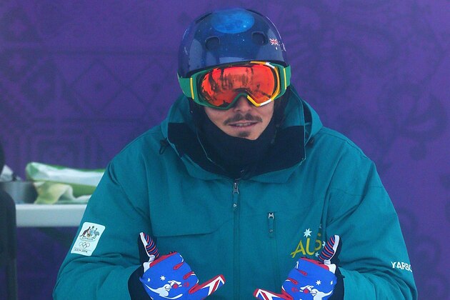 SOCHI, RUSSIA - FEBRUARY 17:  Alex Pullin of Australia looks on as competition is delayed due to weather conditions ahead of the Men's Snowboard Cross Seeding on day ten of the Sochi 2014 Winter Olympics at Rosa Khutor Extreme Park on February 17, 2014 in Sochi, Russia.  (Photo by Quinn Rooney/Getty Images)