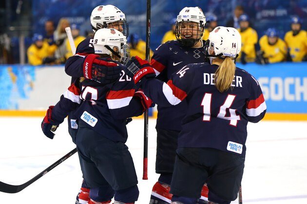 SOCHI, RUSSIA - FEBRUARY 17:  Megan Bozek #9 of the United States celebrates her goal with Kendall Coyne #26, Brianna Decker #14 and Anne Schleper #15 in the second period against Sweden during the Women's Ice Hockey Playoffs Semifinal game on day ten of the Sochi 2014 Winter Olympics at Shayba Arena on February 17, 2014 in Sochi, Russia.  (Photo by Martin Rose/Getty Images)