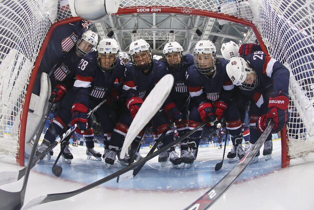 Members of Team USA pack into the opening of the net for a photograph before the first period of the 2014 Winter Olympics women's semifinal ice hockey game against Sweden at Shayba Arena, Monday, Feb. 17, 2014, in Sochi, Russia. (AP Photo/Bruce Bennett, Pool) Members of Team USA pack into the opening of the net for a photograph before the first period of the 2014 Winter Olympics women's semifinal ice hockey game against Sweden at Shayba Arena, Monday, Feb. 17, 2014, in Sochi, Russia. (AP Photo/Bruce Bennett, Pool)