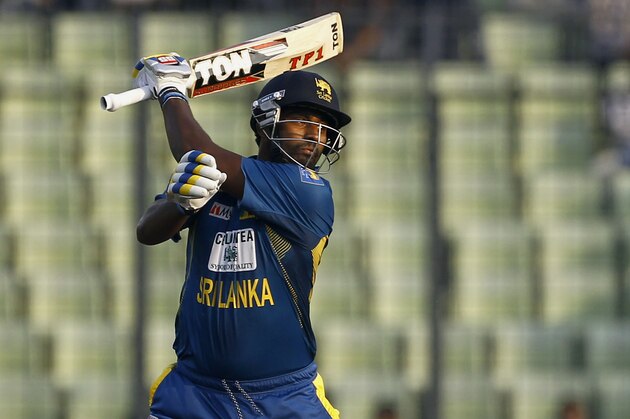 Sri Lanka’s Thisara Perera plays a shot against Bangladesh during their first one day international cricket match in Dhaka, Bangladesh, Monday, Feb. 17, 2014. (AP Photo/A.M. Ahad)