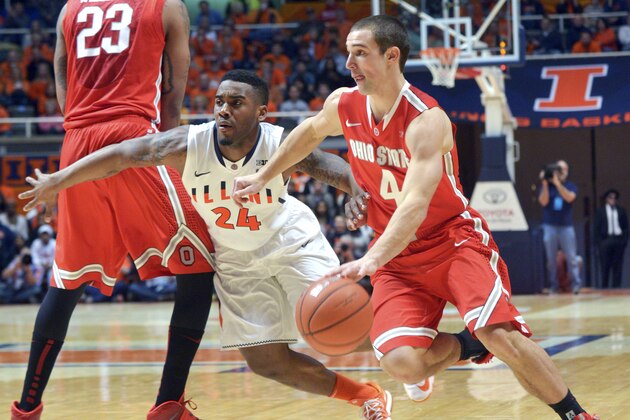 Ohio State's guard Aaron Craft (4) drives to the basket as Illinois' Rayvonte Rice (24) gets around a pick set by Ohio State's center Amir Williams (23) during the second half of an NCAA college basketball game in Champaign, Ill., on Saturday, Feb. 15, 2014. Ohio State won 48-39. (AP Photo/Robin Scholz)