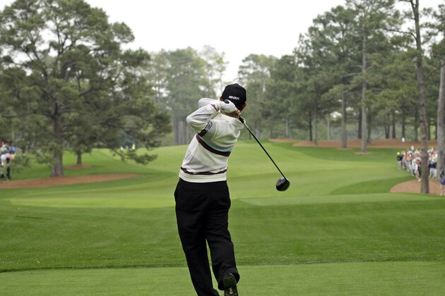 FILE - In this April 8, 2008, file photo, Toru Taniguchi of Japan tees off on the 17th hole of the Augusta National Golf Club, with the Eisenhower Tree at left, during practice for the 2008 Masters golf tournament in Augusta, Ga. The Eisenhower Tree was removed this weekend because of damage from an ice storm, the Augusta National Golf Club chairman Billy Payne said Sunday, Feb. 16, 2014. The loblolly pine was among the most famous trees in golf and it infuriated one of the club members after whom the tree eventually was named — former President Dwight D. Eisenhower. (AP Photo/David J. Phillip, File)