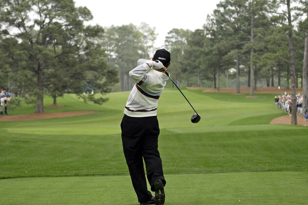 FILE - In this April 8, 2008, file photo, Toru Taniguchi of Japan tees off on the 17th hole of the Augusta National Golf Club, with the Eisenhower Tree at left, during practice for the 2008 Masters golf tournament in Augusta, Ga. The Eisenhower Tree was removed this weekend because of damage from an ice storm, the Augusta National Golf Club chairman Billy Payne said Sunday, Feb. 16, 2014. The loblolly pine was among the most famous trees in golf and it infuriated one of the club members after whom the tree eventually was named — former President Dwight D. Eisenhower. (AP Photo/David J. Phillip, File)
