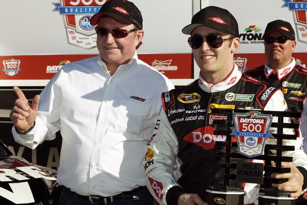 Austin Dillon, right, holds up the pole award with car owner and grandfather Richard Childress after qualifying for the pole position in the Daytona 500 NASCAR Sprint Cup Series auto race at Daytona International Speedway in Daytona Beach, Fla., Sunday, Feb. 16, 2014. (AP Photo/Terry Renna)
