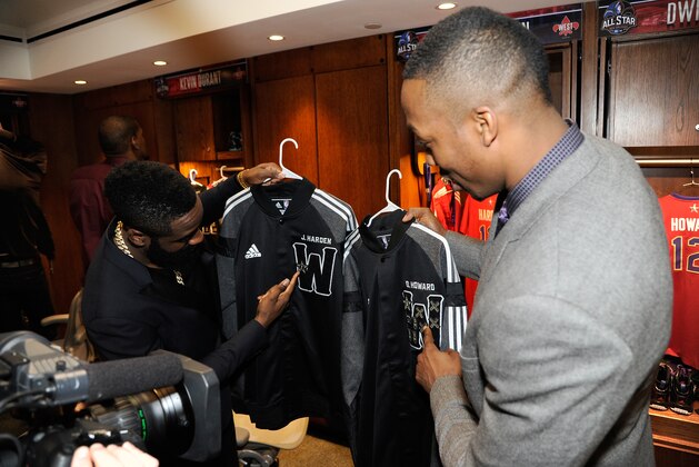 NEW ORLEANS, LA - FEBRUARY 16: (L-R) James Harden #13 and Dwight Howard #12 of the Western Conference All-Stars compare their award patches prior to the 2014 NBA All-Star Game at Smoothie King Center on February 16, 2014 in New Orleans, Louisiana. NOTE TO USER: User expressly acknowledges and agrees that, by downloading and/or using this photograph, user is consenting to the terms and conditions of the Getty Images License Agreement.  Mandatory Copyright Notice: Copyright 2014 NBAE (Photo by Bill Baptist/NBAE via Getty Images)