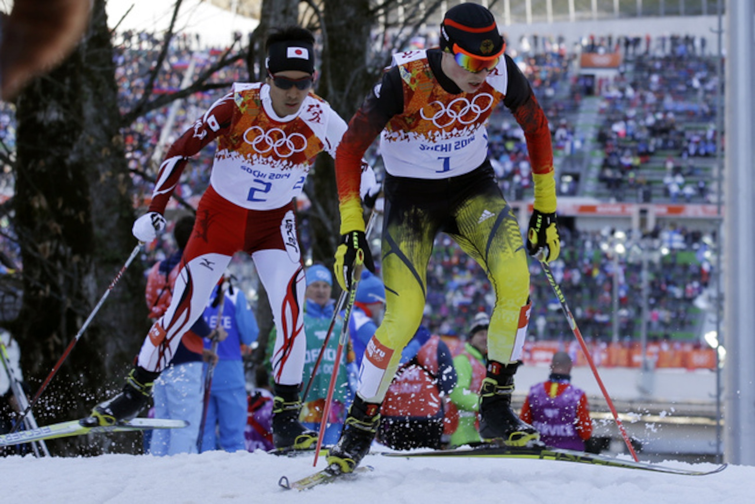Germany's gold medal winner Eric Frenzel, right, and Japan's silver medal winner Akito Watabe ski during the cross-country portion of the Nordic combined at the 2014 Winter Olympics, Wednesday, Feb. 12, 2014, in Krasnaya Polyana, Russia. (AP Photo/Gregorio Borgia)