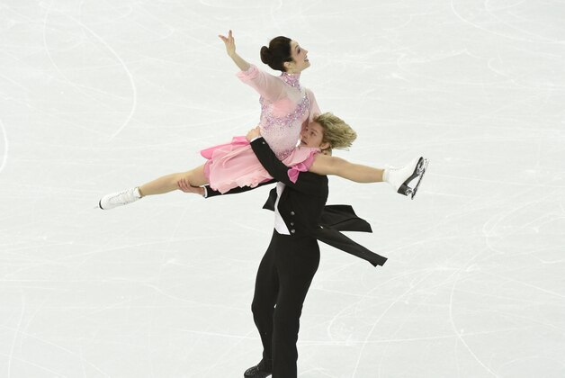 Feb 16, 2014; Sochi, RUSSIA;  Meryl Davis and Charlie White of the USA perform in the ice dance short dance program during the Sochi 2014 Olympic Winter Games at Iceberg Skating Palace. Mandatory Credit: Richard Mackson-USA TODAY Sports