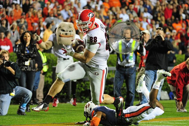 AUBURN, AL - NOVEMBER 16: Arthur Lynch #88 of the Georgia Bulldogs runs with a catch for a 4th quarter touchdown against Ryan White #19 of the Auburn Tigers at Jordan-Hare Stadium on November 16, 2013 in Auburn Alabama. (Photo by Scott Cunningham/Getty Images)
