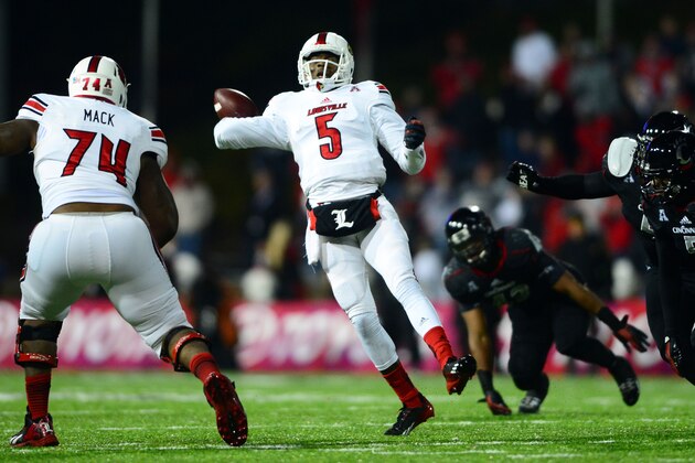 Dec 5, 2013; Cincinnati, OH, USA; Louisville Cardinals quarterback Teddy Bridgewater (5) scrambles out of the pocket and throws a pass for a touchdown during the fourth quarter against the Cincinnati Bearcats at Nippert Stadium. Mandatory Credit: Andrew Weber-USA TODAY Sports