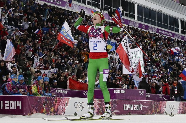 Belarus' Darya Domracheva celebrates winning the gold medal in the women's biathlon 12.5k mass-start, at the 2014 Winter Olympics, Monday, Feb. 17, 2014, in Krasnaya Polyana, Russia. (AP Photo/Felipe Dana)
