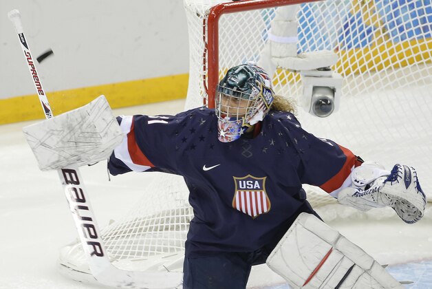 USA Goalkeeper Jessie Vetter blocks a shot by Sweden during the third period of the 2014 Winter Olympics women's semifinal ice hockey game at Shayba Arena, Monday, Feb. 17, 2014, in Sochi, Russia. (AP Photo/Matt Slocum)