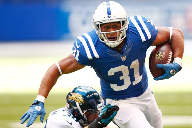 INDIANAPOLIS, IN - SEPTEMBER 23:  Donald Brown #31 of the Indianapolis Colts runs the ball as Russell Allen #50 of the Jacksonville Jaguars makes the tackle from behind at Lucas Oil Stadium on September 23, 2012 in Indianapolis, Indiana. (Photo by Michael Hickey/Getty Images)