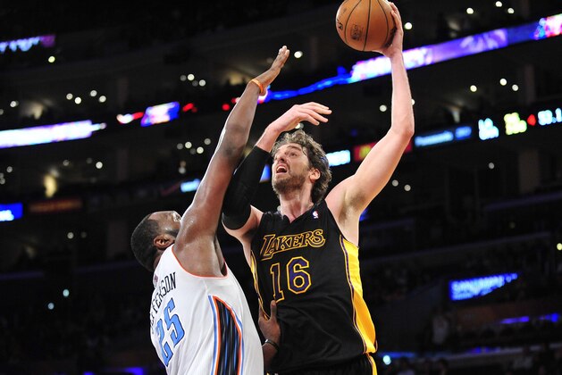 January 31, 2014; Los Angeles, CA, USA; Los Angeles Lakers center Pau Gasol (16) shoots a basket against the defense of Charlotte Bobcats center Al Jefferson (25) during the second half at Staples Center. Mandatory Credit: Gary A. Vasquez-USA TODAY Sports