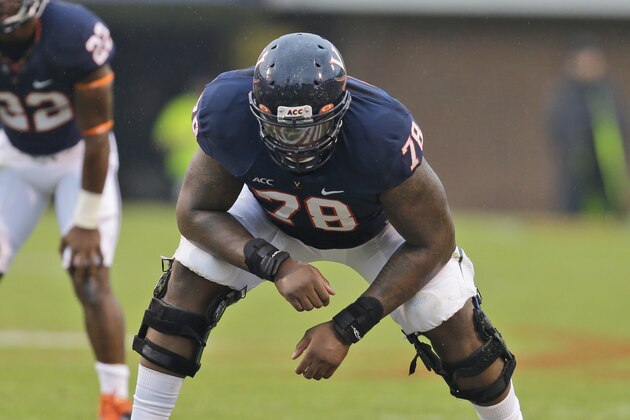 Virginia offensive tackle Morgan Moses (78) lines up during the Virginia Military Institute Virginia college football game in Charlottesville, Va., Saturday, Sept. 21, 2013. (AP Photo/Steve Helber)