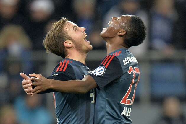 Bayern's Mario Goetze, left, and Bayern's David Alaba of Austria celebrate after the opening goal during the quarterfinal match of the German soccer cup between Hamburger SV and Bayern Munich in Hamburg, Germany, Wednesday, Feb. 12, 2014. (AP Photo/Martin Meissner) Bayern's Mario Goetze, left, and Bayern's David Alaba of Austria celebrate after the opening goal during the quarterfinal match of the German soccer cup between Hamburger SV and Bayern Munich in Hamburg, Germany, Wednesday, Feb. 12, 2014. (AP Photo/Martin Meissner)
