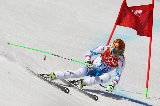 Gold medal winner Anna Fenninger of Austria passes a gate in the women's super-G at the Sochi 2014 Winter Olympics, Saturday, Feb. 15, 2014, in Krasnaya Polyana, Russia. (AP Photo/Alessandro Trovati)