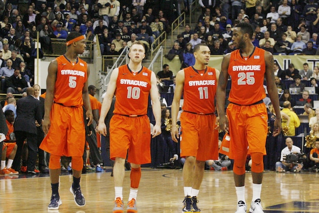 Feb 12, 2014; Pittsburgh, PA, USA; Syracuse Orange forward C.J. Fair (5) and guard Trevor Cooney (10) and guard Tyler Ennis (11) and forward Rakeem Christmas (25) return to the court after a time-out against the Pittsburgh Panthers during the second half at the Petersen Events Center. Syracuse won 58-56. Mandatory Credit: Charles LeClaire-USA TODAY Sports