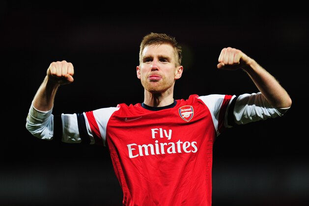 LONDON, ENGLAND - FEBRUARY 16:  Per Mertesacker of Arsenal celebrates at the end of the FA Cup Fifth Round match between Arsenal and Liverpool at the Emirates Stadium on February 16, 2014 in London, England.  (Photo by Shaun Botterill/Getty Images)