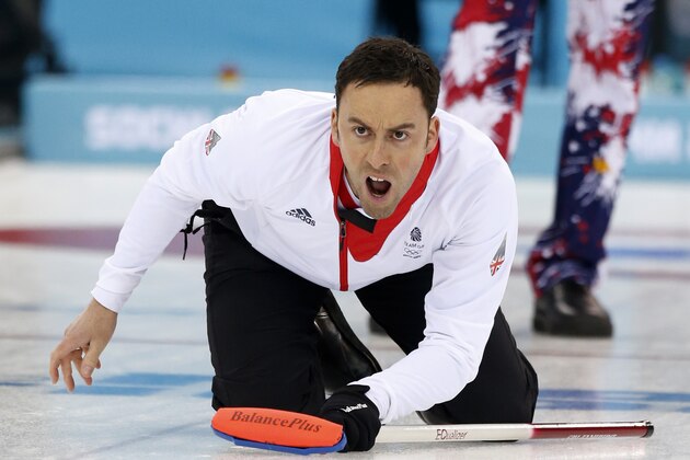 Britain’s skip David Murdoch shouts instructions after delivering the stone during a tiebreaker game against Norway in men's curling competition against at the 2014 Winter Olympics, Tuesday, Feb. 18, 2014, in Sochi, Russia. (AP Photo/Robert F. Bukaty)
