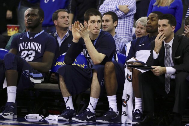 Villanova's Ryan Arcidiacono, center, applauds while on the bench in the second half of an NCAA college basketball game against Creighton in Omaha, Neb., Sunday, Feb. 16, 2014. Creighton won 101-80. (AP Photo/Nati Harnik)