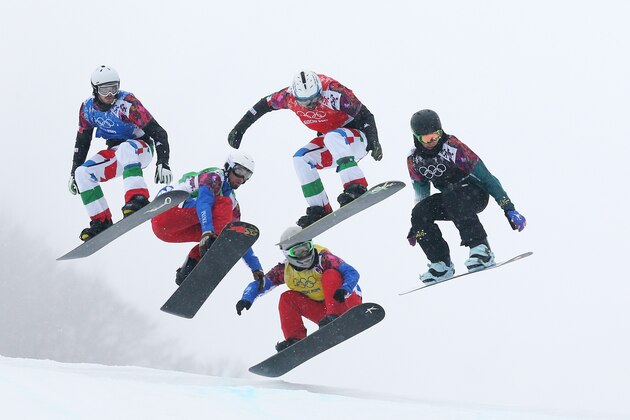 SOCHI, RUSSIA - FEBRUARY 18:  Hanno Douschan of Austria (white bib), Luca Matteotti of Italy (blue bib), Pierre Vaultier of France (green bib), Paul-Henri De Le Rue of France (yellow bib), Omar Visintin of Italy (red bib) and Cameron Bolton of Australia (black bib) compete in the Men's Snowboard Cross Semifinals on day eleven of the 2014 Winter Olympics at Rosa Khutor Extreme Park on February 18, 2014 in Sochi, Russia.  (Photo by Cameron Spencer/Getty Images)