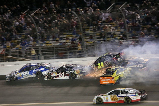 DAYTONA BEACH, FL - FEBRUARY 27:  Tony Stewart, driver of the #14 Office Depot/Mobil 1 Chevrolet, and Ricky Stenhouse Jr., driver of the #6 Ford EcoBoost Ford, spin in front of David Gilliland, driver of the #38 MHP Power Pak Pudding Ford, after an on track incident during the NASCAR Sprint Cup Series Daytona 500 at Daytona International Speedway on February 27, 2012 in Daytona Beach, Florida.  (Photo by Jerry Markland/Getty Images for NASCAR)