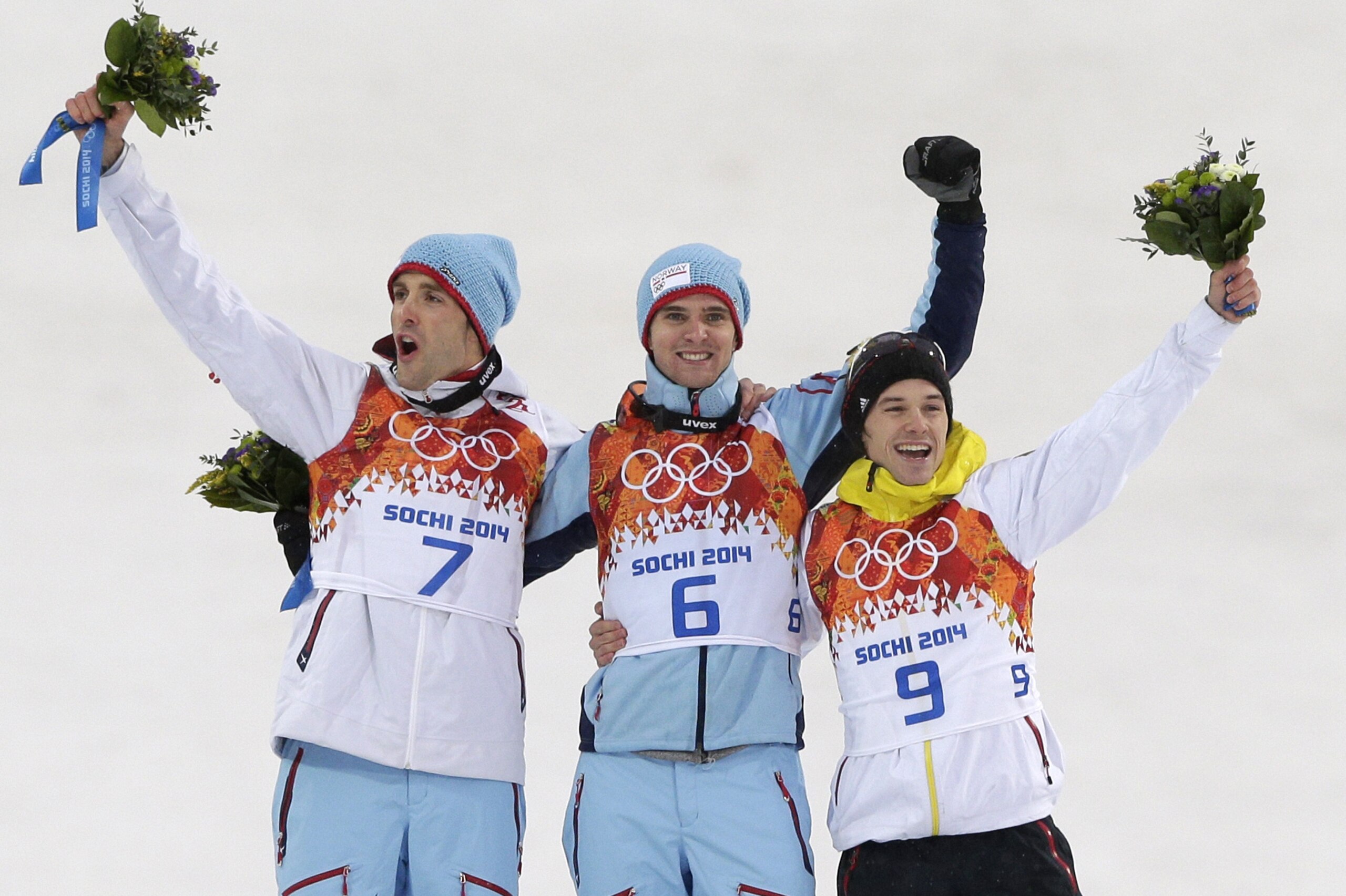 Norway's gold medal winner Joergen Graabak is flanked by Norway's silver medal winner Magnus Hovdal Moan, left, and Germany's bronze medal winner Fabian Riessle during flower ceremony of the Nordic combined individual Gundersen large hill competition at the 2014 Winter Olympics, Tuesday, Feb. 18, 2014, in Krasnaya Polyana, Russia. (AP Photo/Matthias Schrader) Norway's gold medal winner Joergen Graabak is flanked by Norway's silver medal winner Magnus Hovdal Moan, left, and Germany's bronze medal winner Fabian Riessle during flower ceremony of the Nordic combined individual Gundersen large hill competition at the 2014 Winter Olympics, Tuesday, Feb. 18, 2014, in Krasnaya Polyana, Russia. (AP Photo/Matthias Schrader)