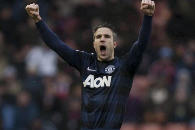 Manchester United's Robin van Persie celebrates after scoring against Stoke during their English Premier League soccer match at the Britannia Stadium, Stoke, England, Saturday Feb. 1, 2014. (AP Photo/Jon Super)