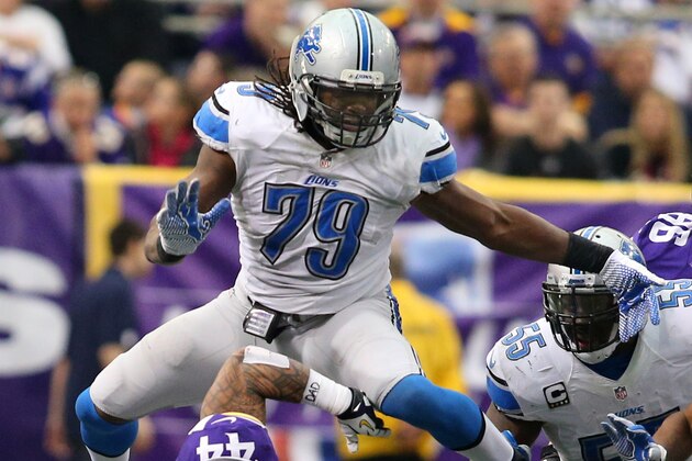 MINNEAPOLIS, MN - DECEMBER 29:  Matt Asiata #44 of the Minnesota Vikings gets knocked over by Willie Young #79 of the Detroit Lions on December 29, 2013 at Mall of America Field at the Hubert H. Humphrey Metrodome in Minneapolis, Minnesota. (Photo by Adam Bettcher/Getty Images)