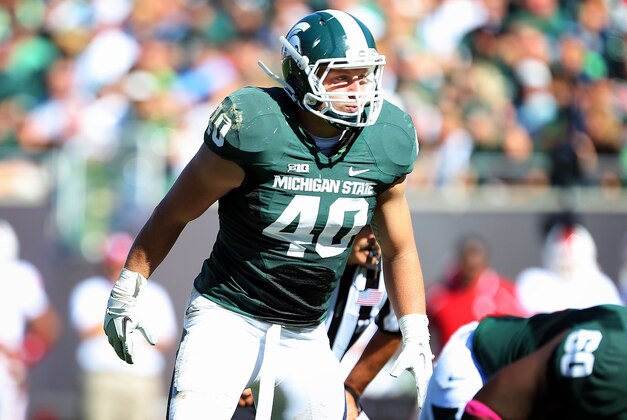Oct 12, 2013; East Lansing, MI, USA; Michigan State Spartans linebacker Max Bullough (40) looks over Indiana Hoosiers offense during the second half in a game at Spartan Stadium. MSU won 42-28. Mandatory Credit: Mike Carter-USA TODAY Sports